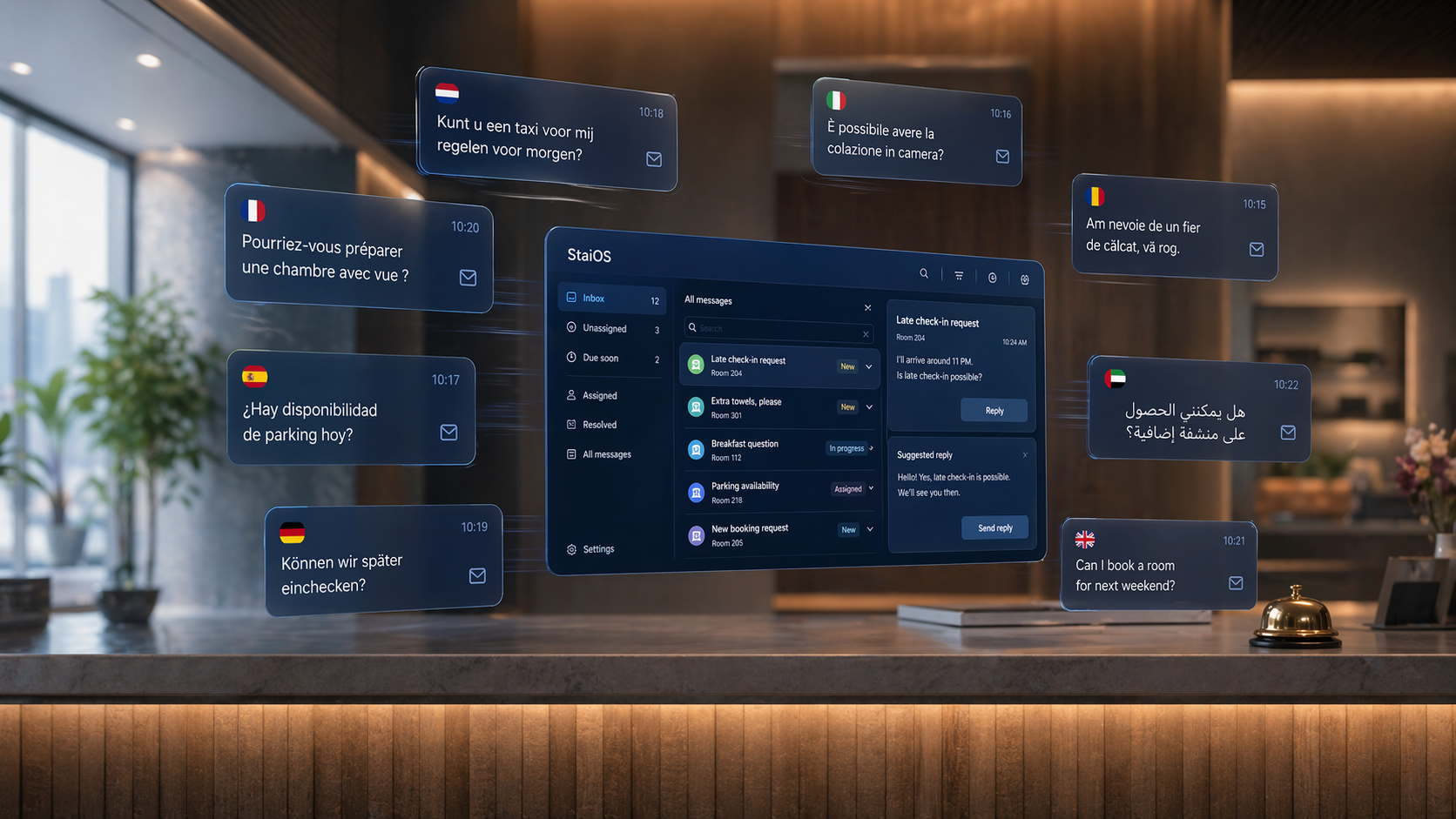 StaiOS mail agent on a monitor in a hotel office, showing multilingual guest-email threads with AI-drafted replies